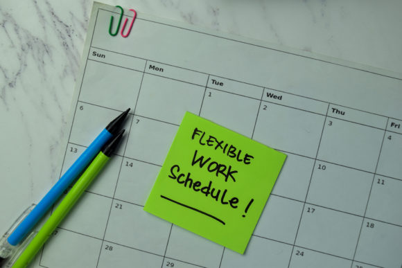 Flexible Work Schedule Write On Sticky Notes Isolated On Office Flexible Work Schedule write on sticky notes isolated on office desk.
